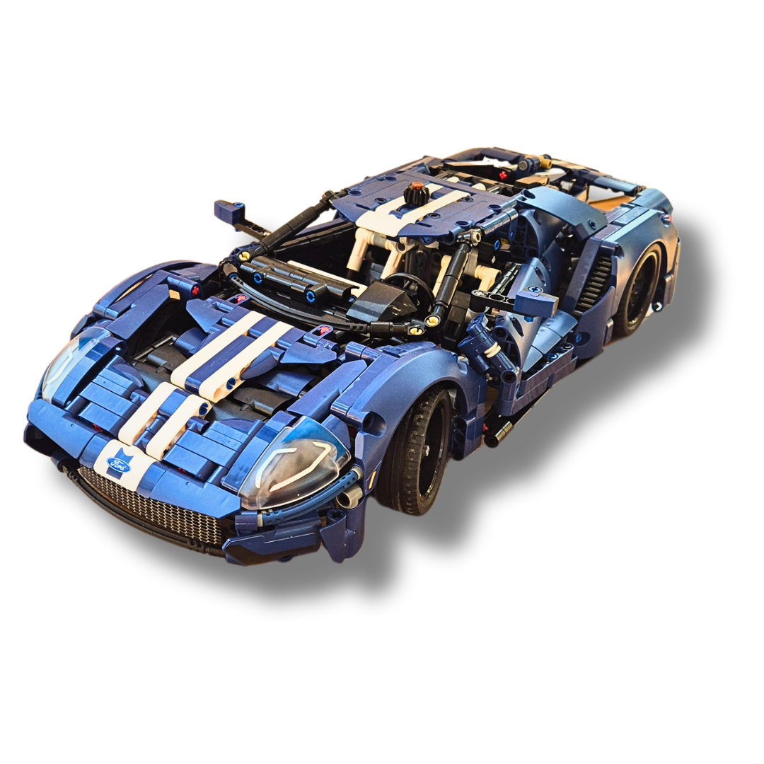 Brick-built Ford GT sports car model in blue with white racing stripes, featuring a detailed aerodynamic design, opening doors, and realistic headlights